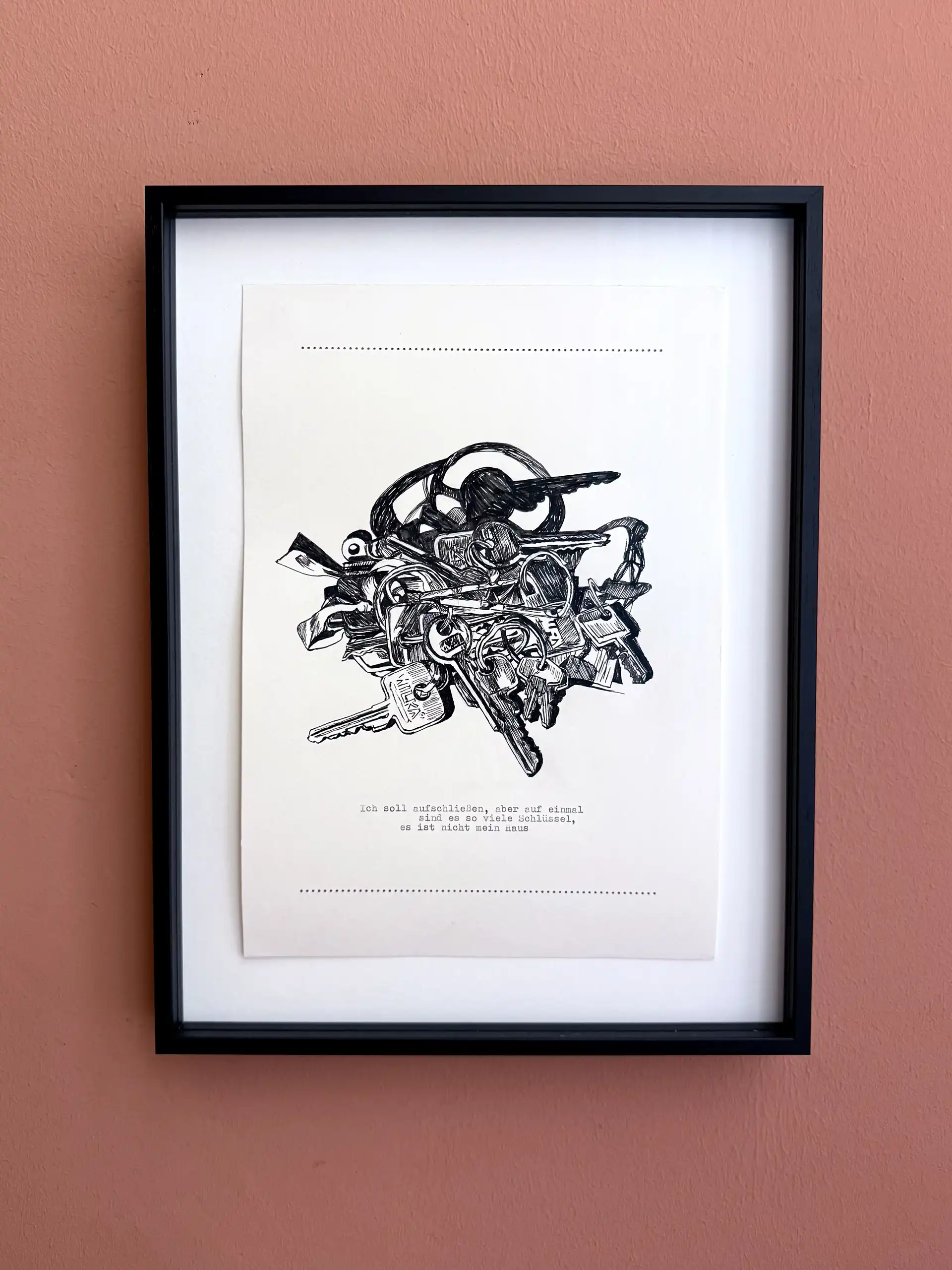 Eine schwarz-weiße Zeichnung von Schlüsseln in einem Bilderrahmen