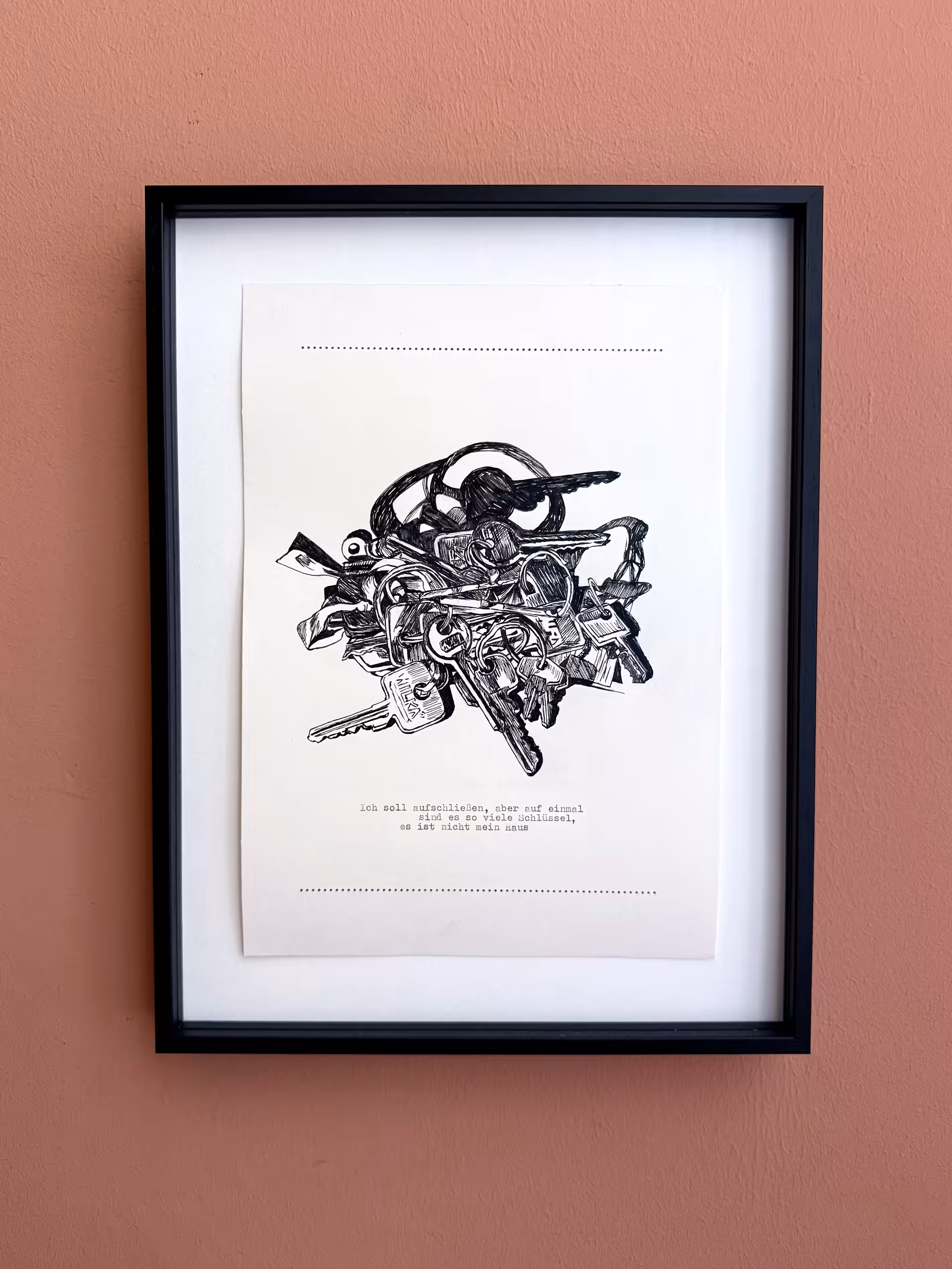 Eine schwarz-weiße Zeichnung von Schlüsseln in einem Bilderrahmen